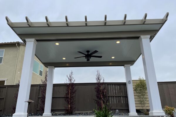 Solid Patio cover with lighting and fan added located in Roseville, CA