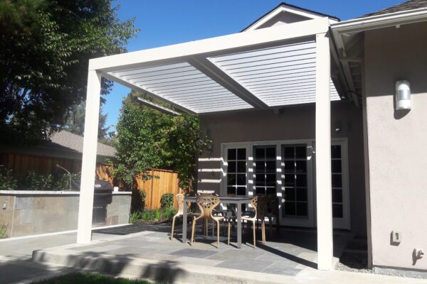 Extruded aluminum post supporting solid patio cover structure installed in Placerville, CA