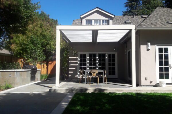 Extruded aluminum post supporting solid patio cover structure installed in Placerville, CA