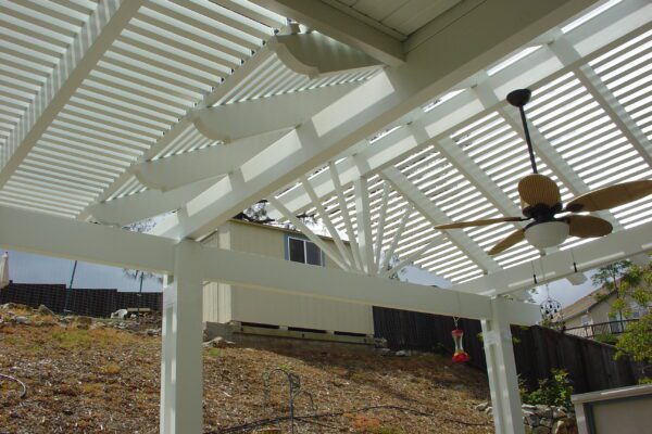 Combination patio cover with solid aluminum roof and open lattice for natural airflow installed in Lincoln, CA