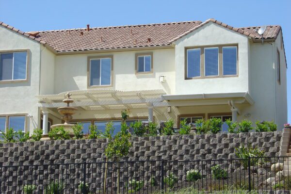 Combination patio cover with solid aluminum roof and open lattice for natural airflow installed in Roseville, CA