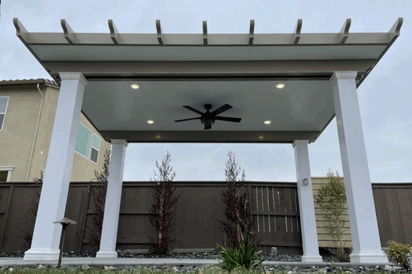 Solid Patio cover with lighting and fan added located in Roseville, CA