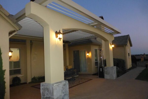 Custom-designed patio cover with integrated lighting and ceiling fan installed in Lincoln, CA