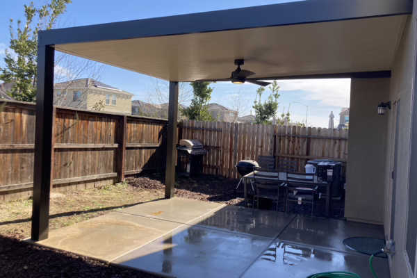 Solid insulated patio Cover with black extruded posts installed in Lincoln, CA